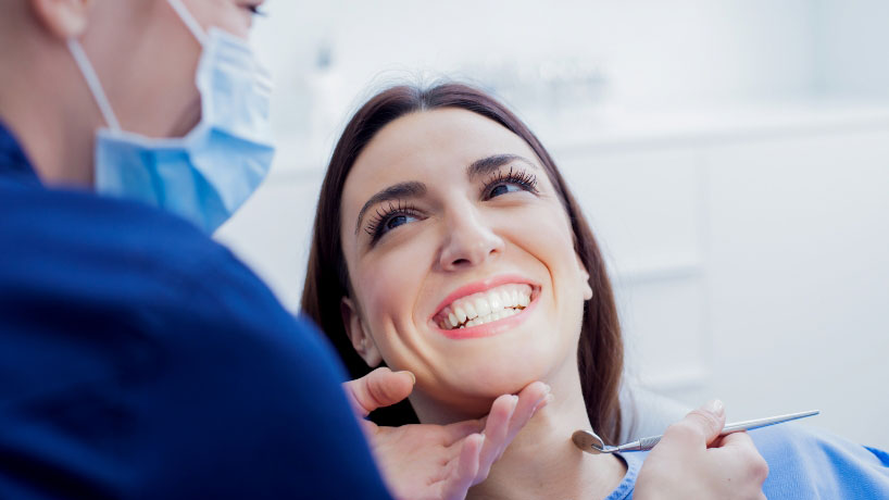woman having dental treatment and smiling